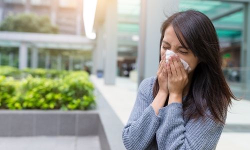 Woman-sneezing